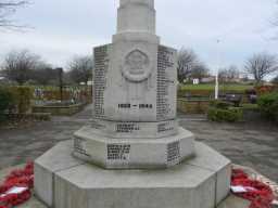 Oblique view of carving and dedications on front of Easington Colliery War Memorial November 2016